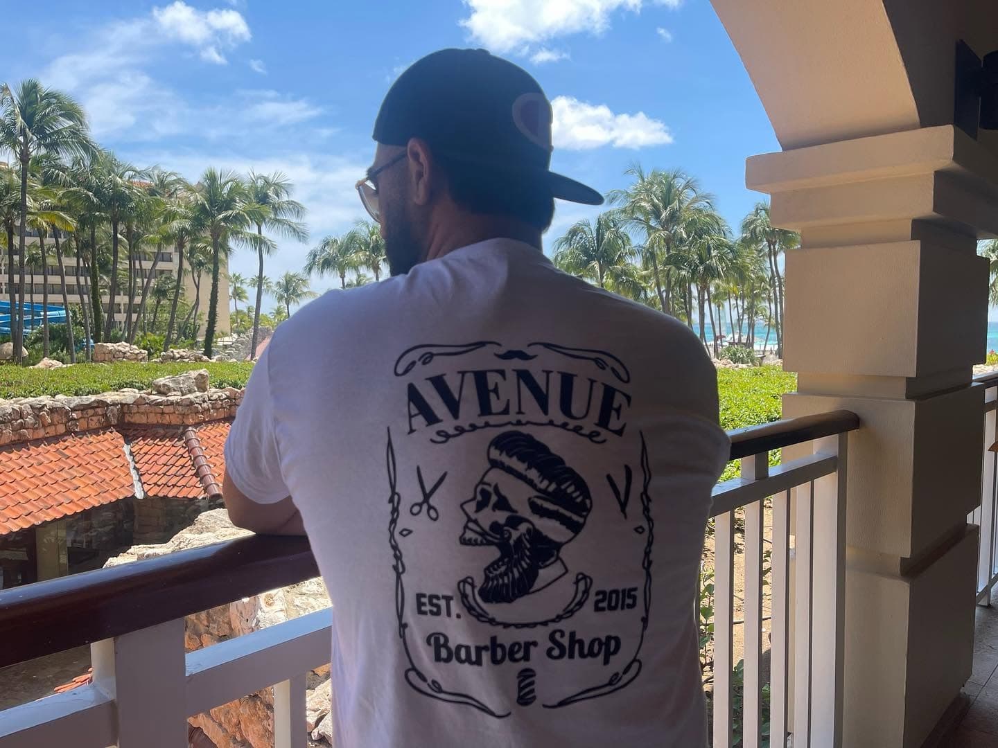 The Avenue Barber Shop tee, logo on the back, on vacation