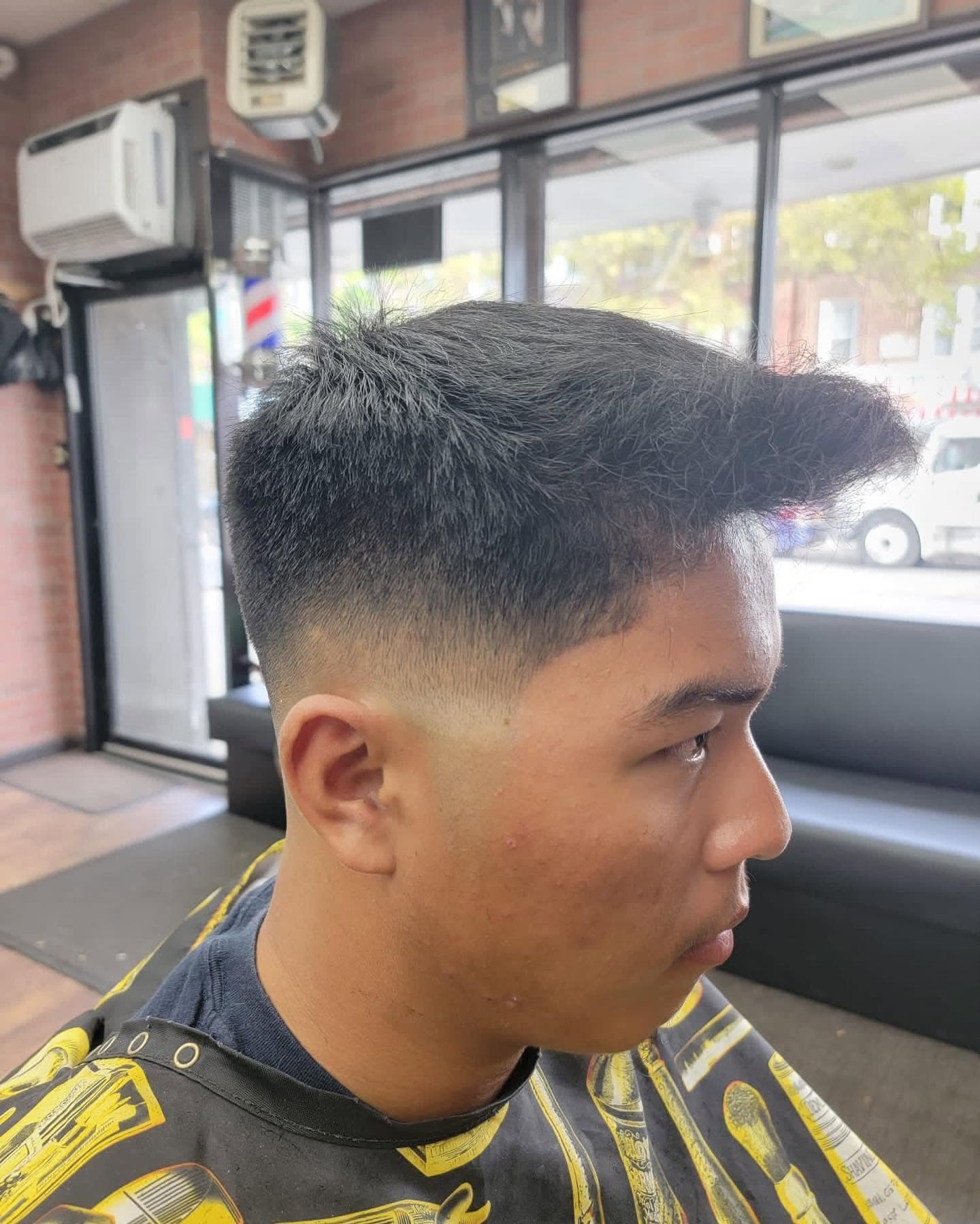 A textured crop with a clean skin fade